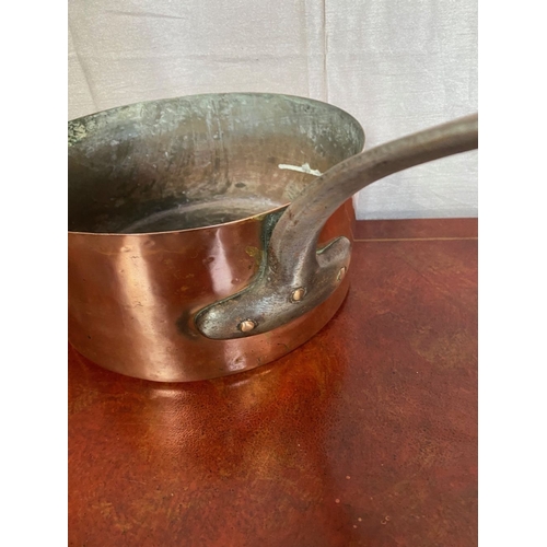 126 - TWO LARGE HEAVY VINTAGE COPPER SAUCEPANS, with cast iron handles.