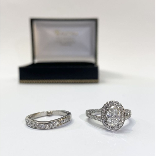 15 - A PLATINUM DIAMOND CLUSTER RING WITH PLATINUM 16 STONE DIAMOND BAND, the cluster ring with central o... 