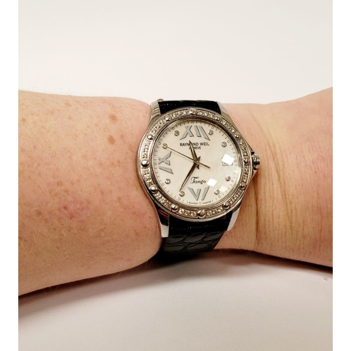 19 - A VERY FINE RAYMOND WEIL DIAMOND ENCRUSTED LADIES WATCH, with leather strap. From the Tango Collecti... 