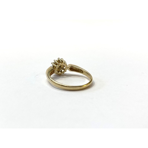 24 - A BEAUTIFUL DIA GOLD DIAMOND CLUSTER RING, with central round cut diamond surrounded by row of six d... 