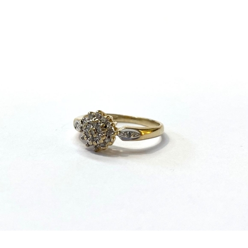 24 - A BEAUTIFUL DIA GOLD DIAMOND CLUSTER RING, with central round cut diamond surrounded by row of six d... 