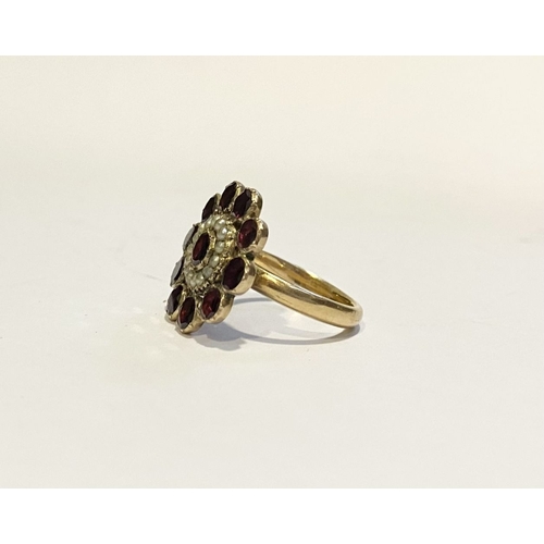 3 - A BEAUTIFUL GARNET SEEDED PEARL 9CT GOLD CLUSTER RING, with central garnet surrounded by row of seed... 