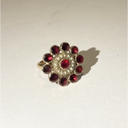 3 - A BEAUTIFUL GARNET SEEDED PEARL 9CT GOLD CLUSTER RING, with central garnet surrounded by row of seed... 