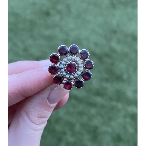 3 - A BEAUTIFUL GARNET SEEDED PEARL 9CT GOLD CLUSTER RING, with central garnet surrounded by row of seed... 