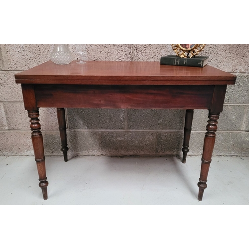 39 - AN IRISH 19TH CENTURY MAHOGANY FOLD OVER DINING / TEA TABLE, with brass hinges to the back of the fo... 