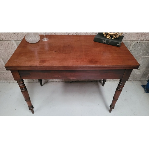 39 - AN IRISH 19TH CENTURY MAHOGANY FOLD OVER DINING / TEA TABLE, with brass hinges to the back of the fo... 