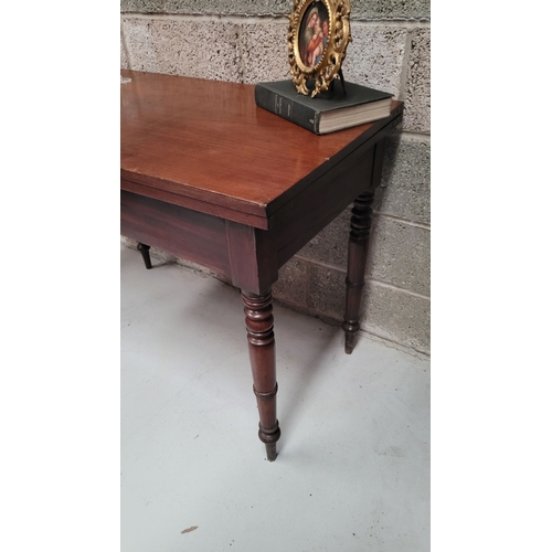 39 - AN IRISH 19TH CENTURY MAHOGANY FOLD OVER DINING / TEA TABLE, with brass hinges to the back of the fo... 