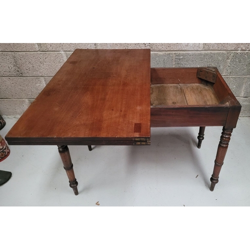 39 - AN IRISH 19TH CENTURY MAHOGANY FOLD OVER DINING / TEA TABLE, with brass hinges to the back of the fo... 