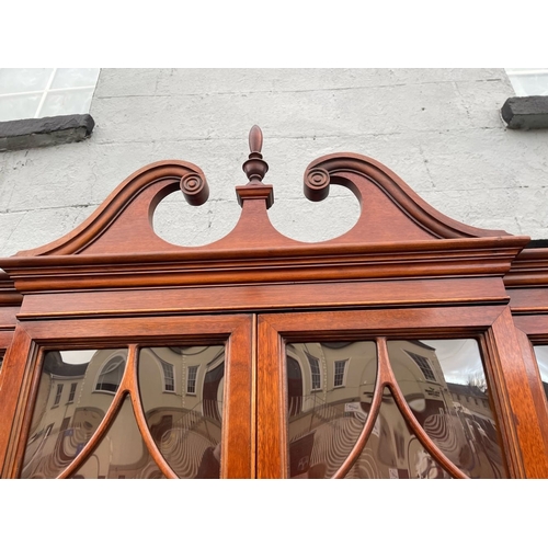 4 - A VERY FINE MAHOGANY BREAKFRONT LIBRARY SECRETAIRE BOOKCASE, to the top a swan neck pediment with fi... 