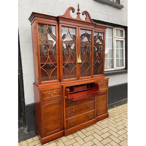 4 - A VERY FINE MAHOGANY BREAKFRONT LIBRARY SECRETAIRE BOOKCASE, to the top a swan neck pediment with fi... 