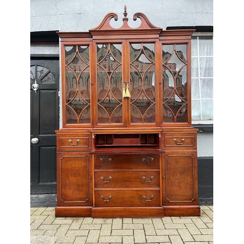 4 - A VERY FINE MAHOGANY BREAKFRONT LIBRARY SECRETAIRE BOOKCASE, to the top a swan neck pediment with fi... 