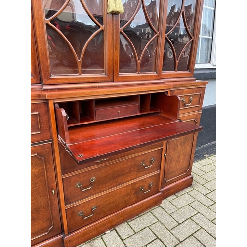 4 - A VERY FINE MAHOGANY BREAKFRONT LIBRARY SECRETAIRE BOOKCASE, to the top a swan neck pediment with fi... 