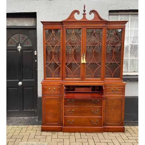 4 - A VERY FINE MAHOGANY BREAKFRONT LIBRARY SECRETAIRE BOOKCASE, to the top a swan neck pediment with fi... 