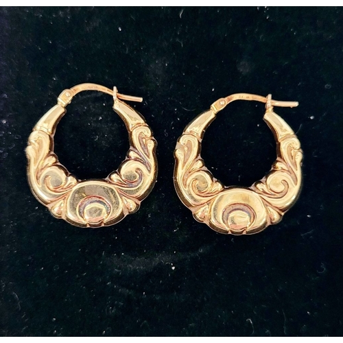 49 - A LOVELY PAIR OF 9CT YELLOW GOLD LOOP EARRINGS, with scrolling foliage design. Marked .375 gold. 2 x... 