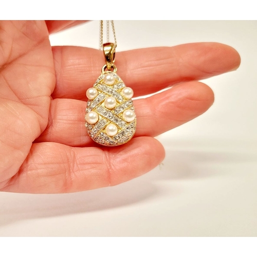 53 - A BEAUTIFUL 14CT YELLOW GOLD CHAIN & PENDANT, the pendant of pear shape with seed pearls dotted abou... 