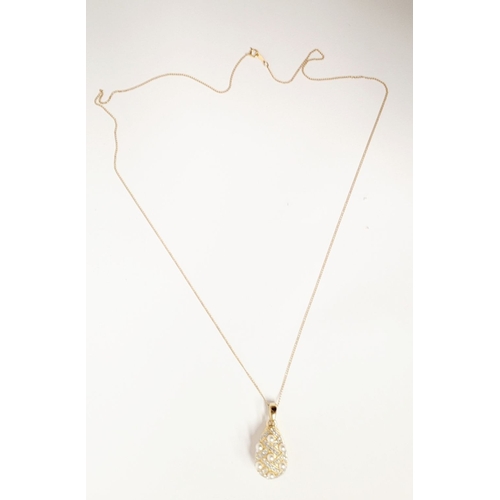 53 - A BEAUTIFUL 14CT YELLOW GOLD CHAIN & PENDANT, the pendant of pear shape with seed pearls dotted abou... 