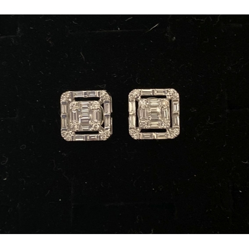 62 - A TIMELESS PAIR OF 18CT WHITE GOLD BAGUETTE CUT DIAMONDS STUD EARRINGS, with baguette and round cut ... 