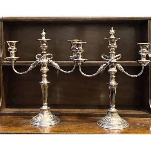 70 - PAIR OF DECORATIVE SHEFFIELD SILVER PLATED CANDLEABRA, each with three branches with scrolling flute... 