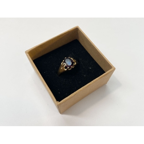 77 - A BEAUTIFUL 9CT YELLOW GOLD GARNET SOLITAIRE RING, oval cut garnet in ten prong claw setting with ta... 