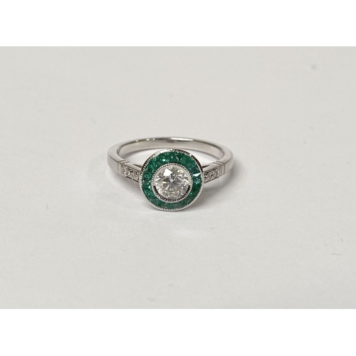 8 - AN ART DECO STYLE 18CT WHITE GOLD COLUMBIAN EMERALD AND DIAMOND TARGET RING, with central round bril... 