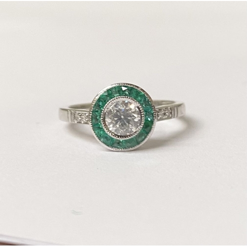 8 - AN ART DECO STYLE 18CT WHITE GOLD COLUMBIAN EMERALD AND DIAMOND TARGET RING, with central round bril... 