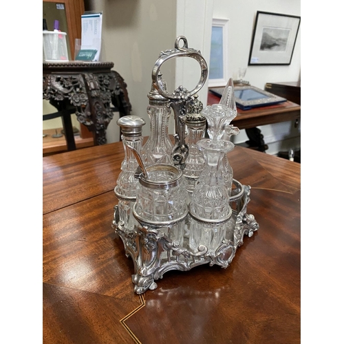 81 - A GOOD HEAVY DECORATIVE SILVER & SILVER PLATED CRUET STAND, with handle to centre, engraved monogram... 