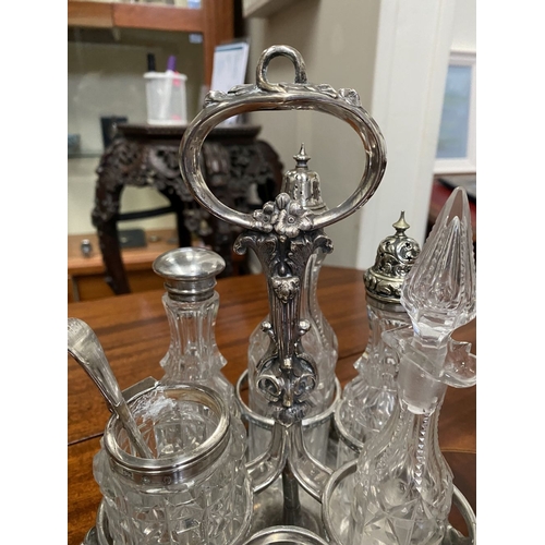 81 - A GOOD HEAVY DECORATIVE SILVER & SILVER PLATED CRUET STAND, with handle to centre, engraved monogram... 