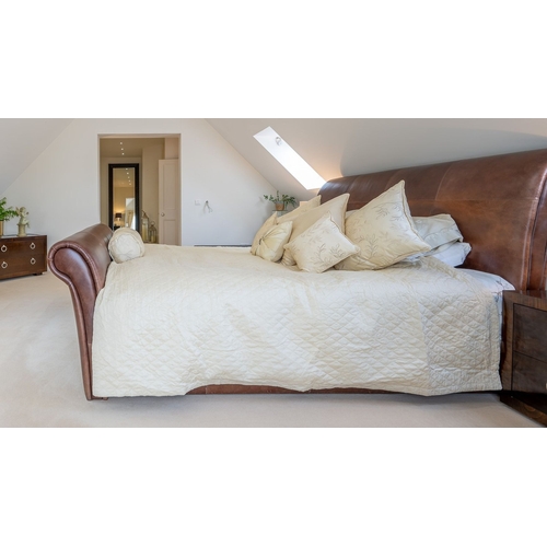 92 - A LEATHER UPHOLSTERED CONTEMPORARY KING SIZE SLEDGE BED, a beautiful piece of home décor in very goo... 