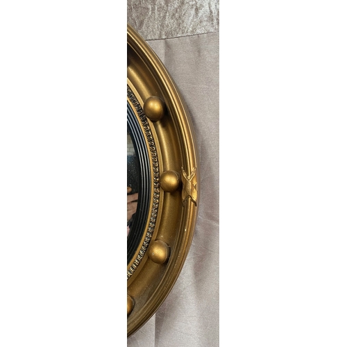 95 - A GOOD QUALITY GILT CONVEX WALL MIRROR – CIRCULAR, with regency style ball & ribbon design to the fr... 