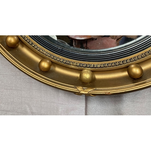 95 - A GOOD QUALITY GILT CONVEX WALL MIRROR – CIRCULAR, with regency style ball & ribbon design to the fr... 