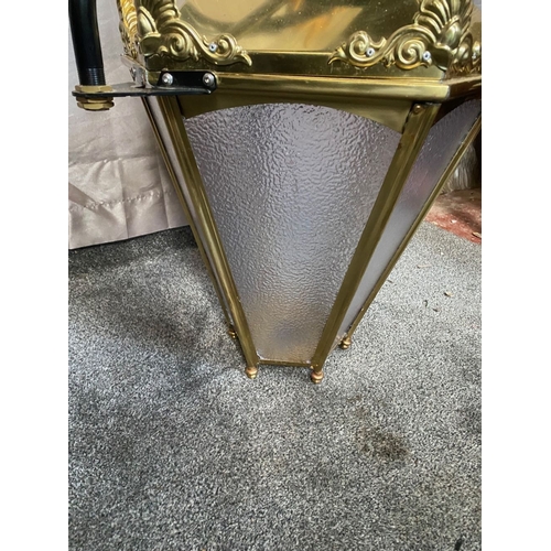 98 - A LARGE BRASS HANGING LANTERN, with black metal tri-bar supports/bracket, the lantern has frosted gl... 