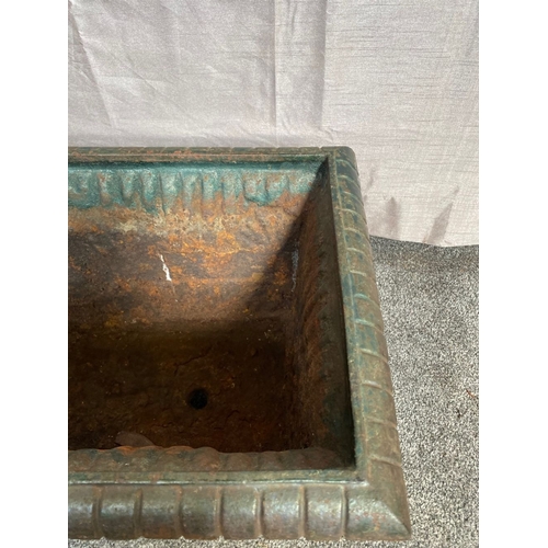 100 - A VICTORIAN CAST IRON GARDEN PLANTER, with tapered body, highly decorated with central panel surroun... 