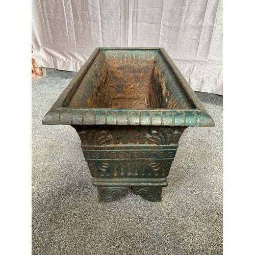 100 - A VICTORIAN CAST IRON GARDEN PLANTER, with tapered body, highly decorated with central panel surroun... 