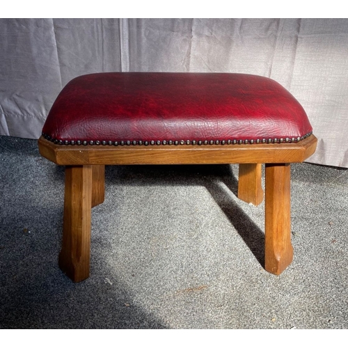 104 - A RED LEATHER UPHOLSTERED FOOTSTOOL, deep red leather stud upholstered, on carved hardwood base. Dim... 