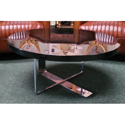 114 - A CONTEMPORARY PORADA LOW RISE CIRCULAR COFFEE TABLE, with chrome metal base, and black circular top... 