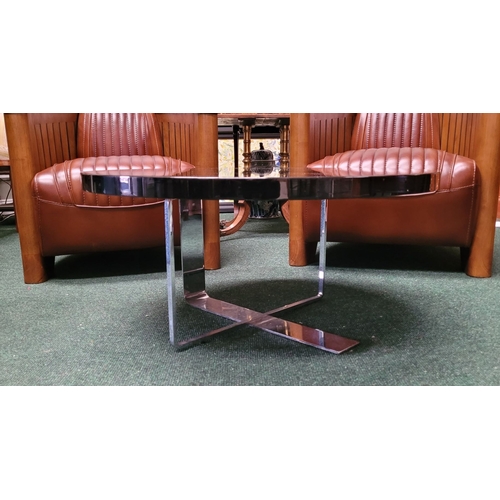 114 - A CONTEMPORARY PORADA LOW RISE CIRCULAR COFFEE TABLE, with chrome metal base, and black circular top... 