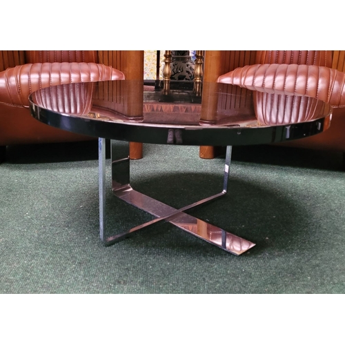 114 - A CONTEMPORARY PORADA LOW RISE CIRCULAR COFFEE TABLE, with chrome metal base, and black circular top... 