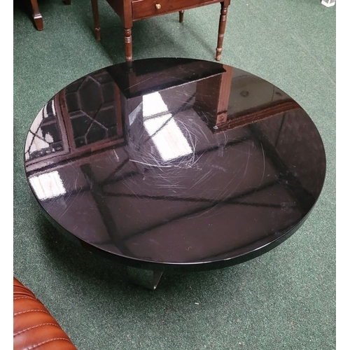 114 - A CONTEMPORARY PORADA LOW RISE CIRCULAR COFFEE TABLE, with chrome metal base, and black circular top... 