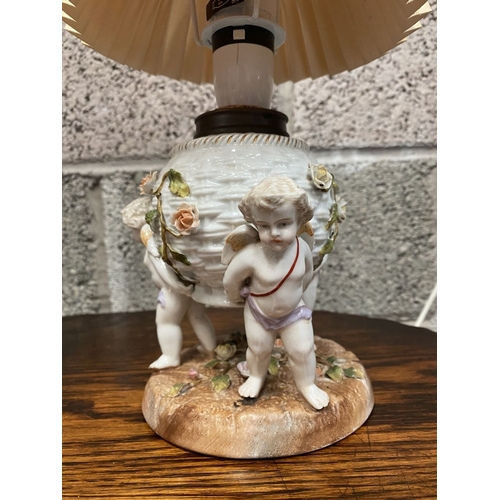 126 - TWO EARLY 20TH CENTURY GERMAN PORCELAIN TABLE LAMPS, (i) numbered and marked to base with double ove... 