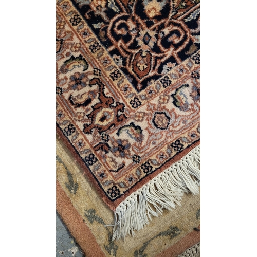 129 - A GOOD QUALITY TAPRIZ FLOOR RUG, with floral design, having a central medallion, and long fringe to ... 