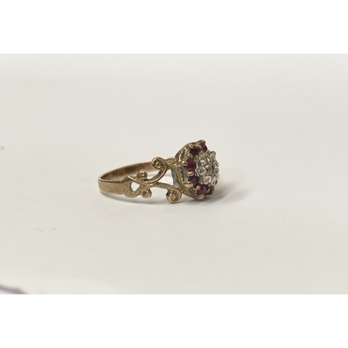 133 - A UNIQUE VINTAGE 9CT YELLOW GOLD DIAMOND AND RUBY CLUSTER RING, with central round cut diamond in il... 