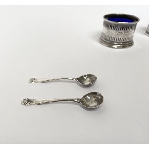 134 - A PAIR OF SILVER SALTS WITH SPOONS, the salts with blue glass liners and openwork design to body, on... 