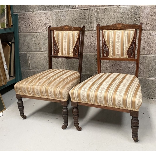 136 - A PAIR OF VICTORIAN ROSEWOOD INLAID NURSING CHAIRS, with upholstery to backrest surrounded by scroll... 