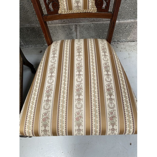 136 - A PAIR OF VICTORIAN ROSEWOOD INLAID NURSING CHAIRS, with upholstery to backrest surrounded by scroll... 