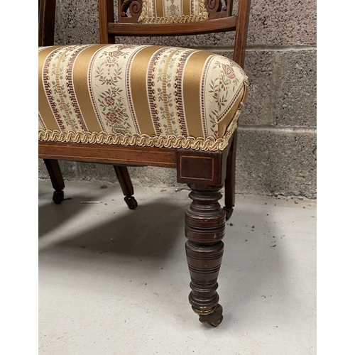 136 - A PAIR OF VICTORIAN ROSEWOOD INLAID NURSING CHAIRS, with upholstery to backrest surrounded by scroll... 