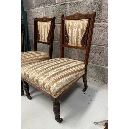 136 - A PAIR OF VICTORIAN ROSEWOOD INLAID NURSING CHAIRS, with upholstery to backrest surrounded by scroll... 