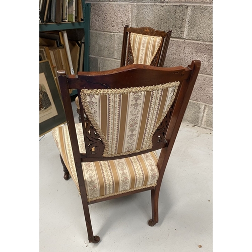 136 - A PAIR OF VICTORIAN ROSEWOOD INLAID NURSING CHAIRS, with upholstery to backrest surrounded by scroll... 