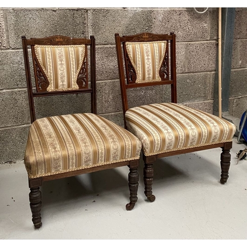 136 - A PAIR OF VICTORIAN ROSEWOOD INLAID NURSING CHAIRS, with upholstery to backrest surrounded by scroll... 