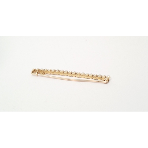 141 - A VINTAGE 18CT YELLOW GOLD & PEARL BAR BROOCH, 5cm long.