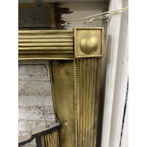 151 - AN EXCELLENT GEORGE III BRASS FIRE GRATE, the moulded brass frame with roundels to each corner, we w... 